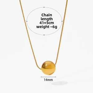 Macro shot of 14mm polished golden ball pendant on a 41+5cm sleek snake chain necklace