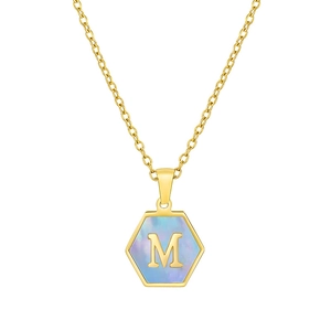 Macro detail of 18K gold stainless steel hexagon necklace with M letter and blue shell