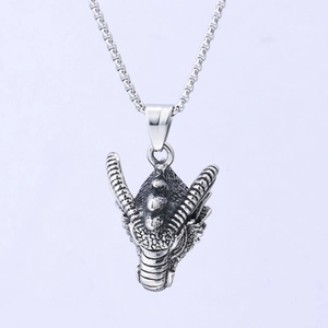 Vintage stainless steel dragon head pendant necklace with detailed scales on purple background