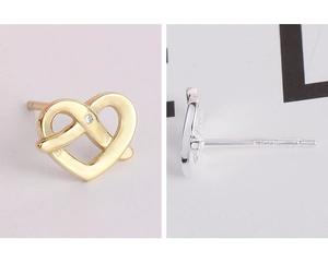 Detailed macro view of S925 sterling silver hallmark on twisted heart stud earrings
