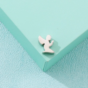 Polished stainless steel angel pendant displayed on a minimalist bicolored background
