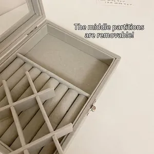 Gray velvet jewelry box with clear window and removable dividers for rings and earrings