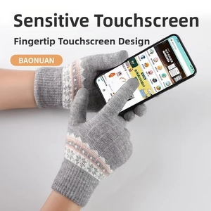 Close-up of gray knit gloves with Nordic jacquard pattern and touchscreen fingertips