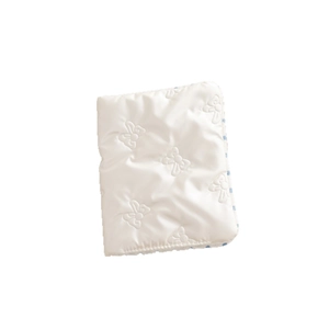 Minimalist white quilted passport holder with cute embroidered bow pattern for travel