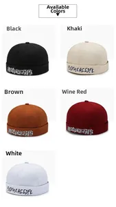 Detail showing five colors of brimless skull caps with premium letter embroidery