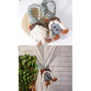 Christmas gnome curtain buckles shown holding back a white curtain in a home setting