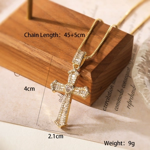 Detail view of 18K gold plated cross necklace with heart gemstone and size parameters