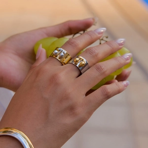 Luxurious gold and silver cherry shaped stainless steel rings for women on hand