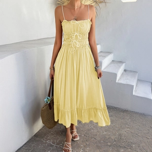 Yellow A-line sundress with drawstring chest, ruffled hem, and smocked waist detail
