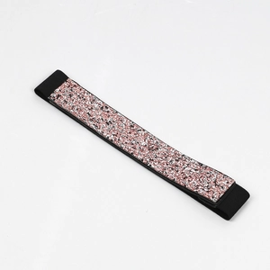 Detail view of pink sequins and black elastic webbing on this sparkling waist belt