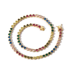 Detailed close-up of colorful heart-shaped zircon tennis chain with gold plating and safety clasp