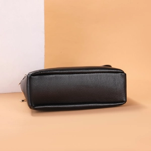 Black PU leather women crossbody shoulder bag, stylish casual handbag bottom view for daily wear.