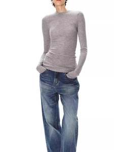 Full view of gray long sleeve wool T-shirt and dark blue wide leg denim jeans