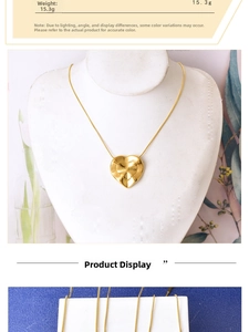Macro detail of a 15.3g textured gold heart pendant with a unique wavy metal surface