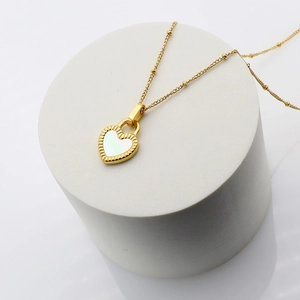 Minimalist 18K gold plated heart necklace with white pearl inlay on a beaded chain