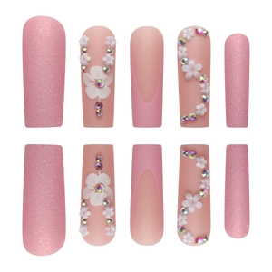 Pink French glitter press-on nails with 3D white resin flowers and rainbow rhinestones