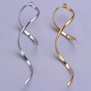 Close-up of elegant gold and silver 304 stainless steel ribbon pendant charms for jewelry