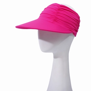 Detail of rose pink sun visor hat with elastic pleated fabric and wide protective brim