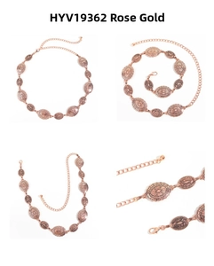 Detailed macro view of rose gold metal chain belt with vintage embossed oval discs