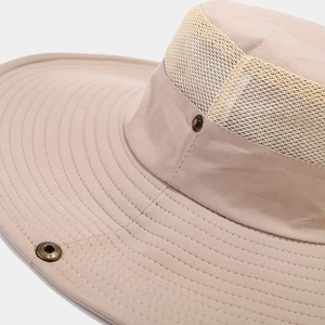 Detail of outdoor sun hat with breathable mesh fabric and vintage metal snaps