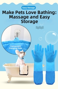 Detail of blue silicone pet grooming glove with hanging hole and dense massage bristles