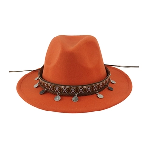 Bright orange felt fedora hat with ethnic patterned band and silver coin pendants