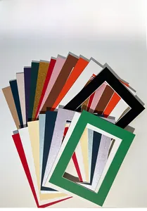 Close-up of colorful paper photo frames showing textured finishes and various bright colors