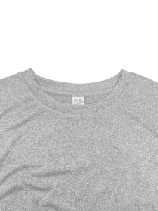 Detail of the crew neck and size M tag on a grey slim-fit breathable athletic t-shirt
