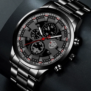Detail view of black stainless steel chronograph watch with tachymeter and date display