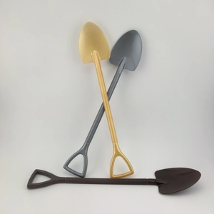 Three mini decorative plastic sand shovels in gold grey and brown with D-handles