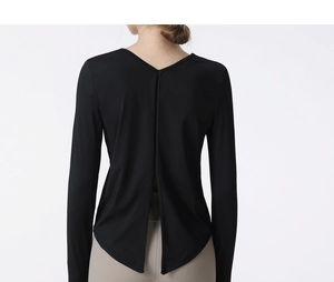 Macro shot of back deep V-split design on black quick-dry long sleeve yoga shirt