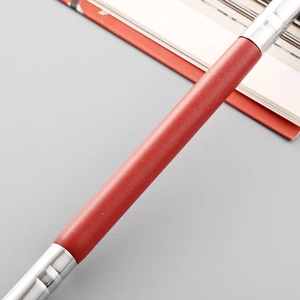 Dual-ended red makeup brush with silver ferrules for eyeshadow and eyeliner application