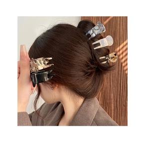 Close-up of assorted acetate hair claws in tortoise shell and marble patterns
