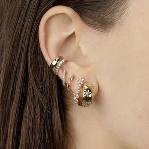 Gold geometric zircon hoop earrings set with sparkling stones on model ear