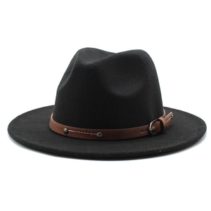 Detail view of black felt fedora hat featuring a brown leather strap with silver rivets