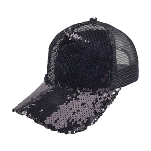 Detailed view of black sequins and breathable mesh fabric on a stylish baseball cap