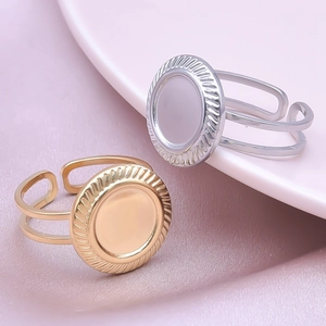 Macro shot of geometric round disc adjustable rings in gold and silver stainless steel