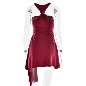 Detail of red backless halter mini dress with asymmetric hem on professional mannequin