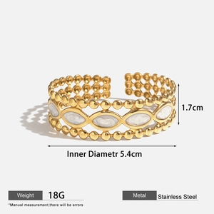 Detail view of gold stainless steel bangle with dimensions 1.7cm height and 5.4cm inner diameter