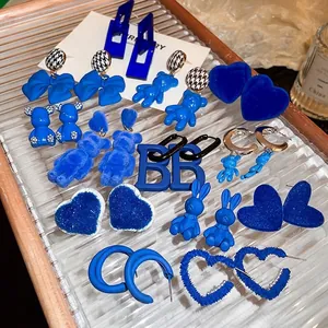 Klein blue velvet bear and heart earring set with stylish fabric bow accents