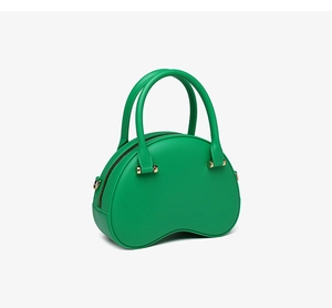 Side view of green PVC jelly bag featuring a crescent shape and gold metal accents