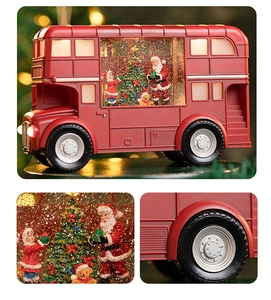 Detail view of red Christmas bus ornament with LED lights and swirling glitter snow effect