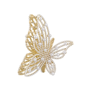 Elegant gold butterfly hair claw clip with inlaid pearls on a clean white background