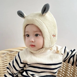 Beige baby knit earflap hat with gray ear decor and dog patch on warm winter cap