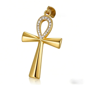 Polished gold Ankh cross pendant with clear cubic zirconia pavé stones on a white background