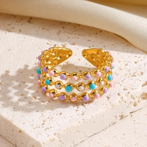 Three-layer gold stainless steel open ring with colorful enamel beads on a stone base
