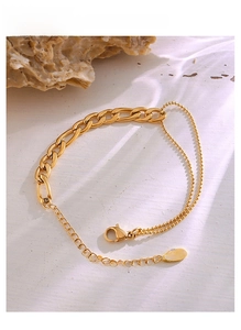 Detailed macro view of 18K gold-plated double-layer Figaro and beaded chain with K18 stamp