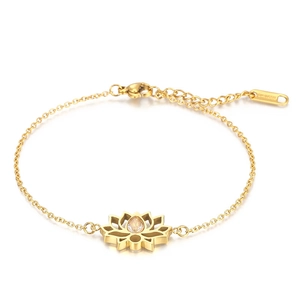Detail of gold stainless steel lotus bracelet with a sparkling cubic zirconia stone