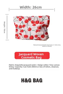 Detail view of cherry jacquard makeup bag showing dimensions 26cm width and 18cm height