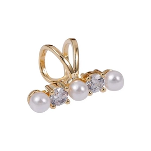 Gold ear cuff featuring alternating white pearls and zircon stones on a U-shaped clip